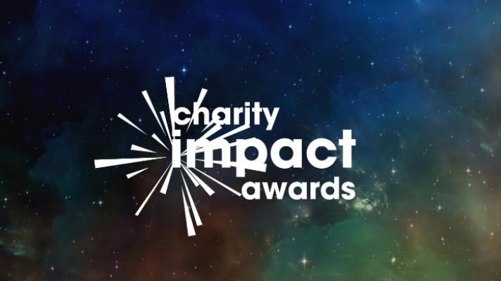 Charity Impact Awards logo on a galactic background.
