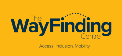 The WayFinding Centre logo on a mustard yellow background. The name is written in dark blue text with a dotted arc above the word 'Finding'. Below the logo, a tagline reads: 'Access. Inclusion. Mobility.