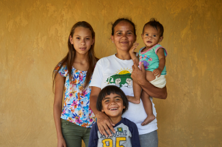 Angela, Standing Her Ground, with three of her children in Honduras