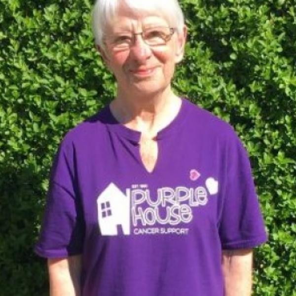 A photo of Janet Smith wearing a Purple House Cancer Support tshirt