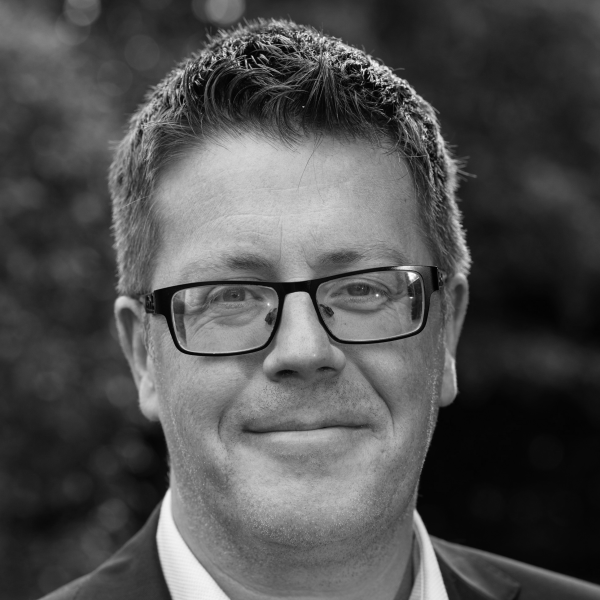 A black and white headshot of Emmet O'Hara
