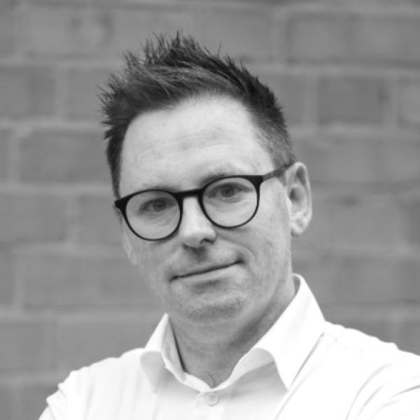 Black and white headshot of Mark McKerrow