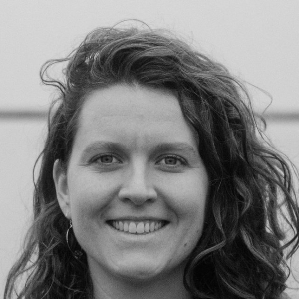 A black and white headshot of Sarah Broderick