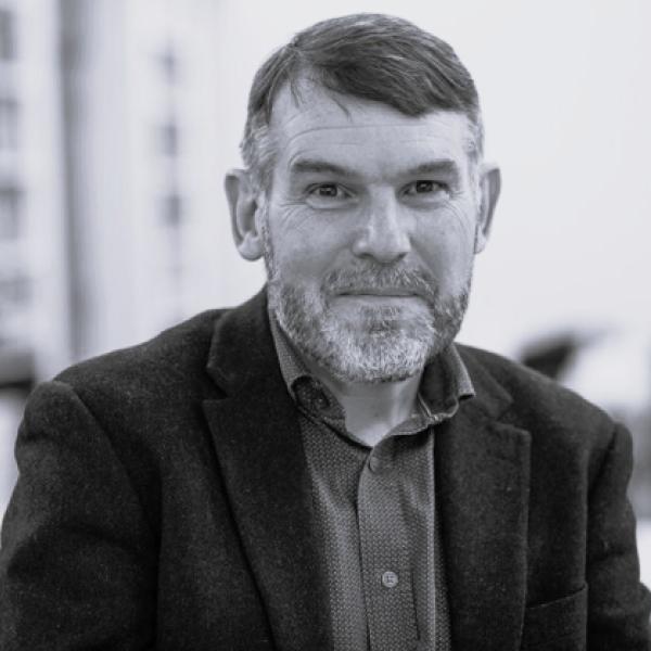 Headshot of Colm Ó Cuanacháin