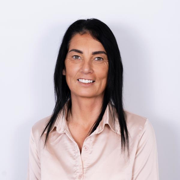 Picture of Bridget Kelly in a pale coloured shirt. 