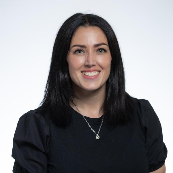 Picture of Dearbháil Lawless in plain black top with necklace. 