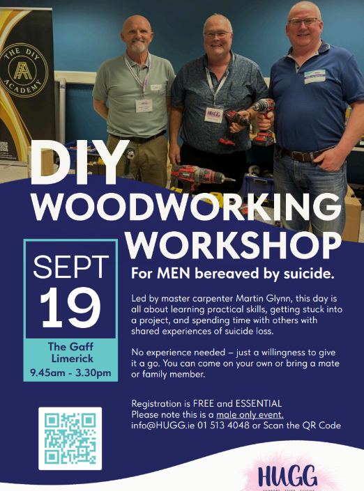 Three smiling men stand together behind a sign for a DIY woodworking workshop for men bereaved by suicide, scheduled for September 19 at The Gaff, Limerick, with registration details and a QR code visible.