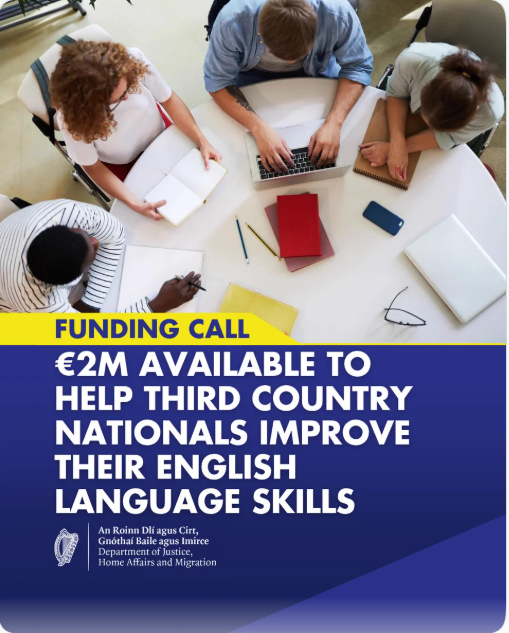 Four people sit around a circular table working on laptops and notebooks, with text overlay reading: Funding call: €2M available for organisations to help third country nationals improve their English language skills, from the Department of Justice.