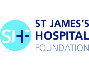 Logo for St. Jamess Hospital Foundation, featuring the letters SJH inside a light blue circle next to the organizations name in dark blue text.
